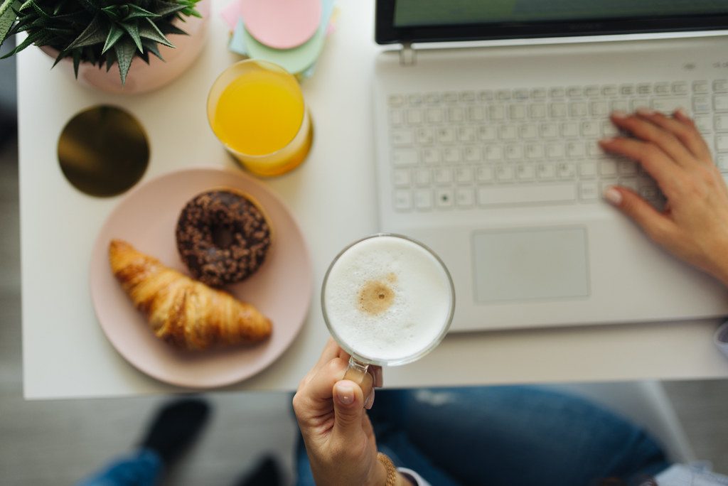 A relaxed breakfast and work set-up at home with coffee