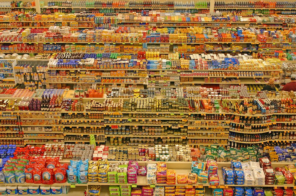 A large retail store interior with rows of products
